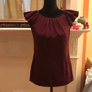 Capped ruffle sleeve top with pleat detail